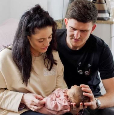 Lillie Saint Maguire with her parents Harry Maguire and Fern Hawkins.